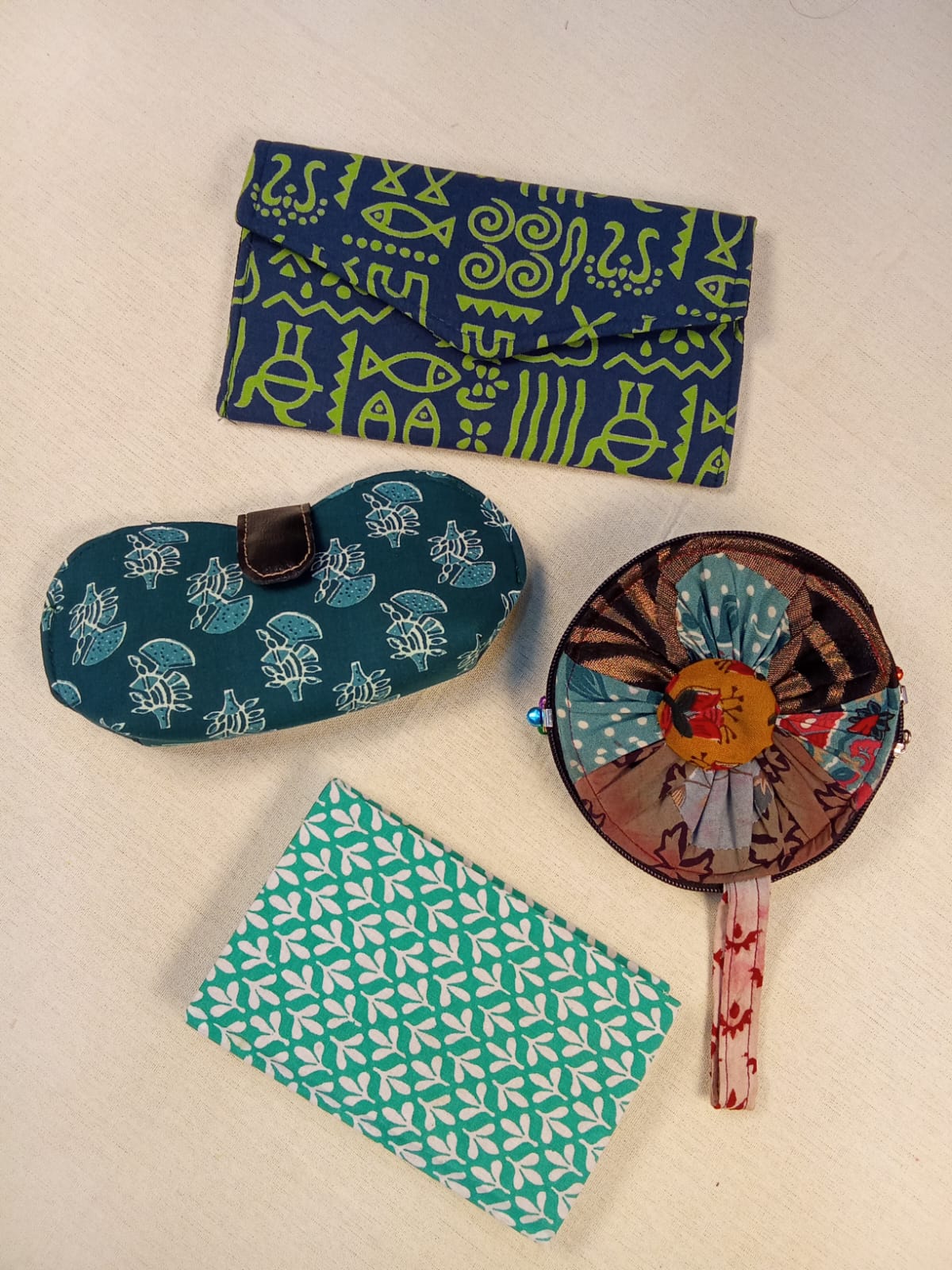 Set of Green Printed Diary, Blue Warli Print Clutch, Teal Floral Eyewear Case & Patchwork Coin Pouch - Work & Wonder